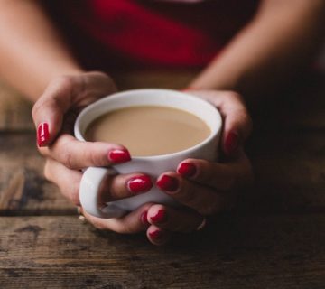Women holding cup of coffee 701786 360x320
