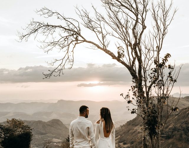 a-couple-in-white-dress-standing-in-view-of-the-mountain-2917382 A couple in white dress standing in view of the mountain 2917382
