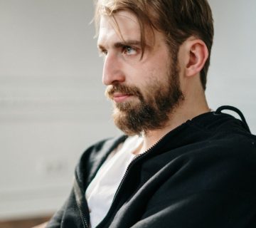 Man in black jacket sitting on chair 4101204 360x320
