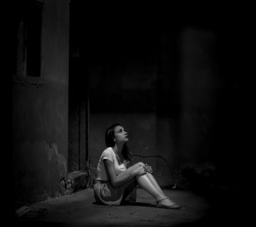 Monochrome photo of woman sitting on floor 2223064 360x320