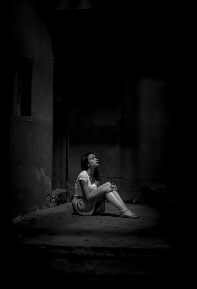 Monochrome photo of woman sitting on floor 2223064