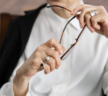 Person in white dress shirt holding silver ring 4098335 360x320