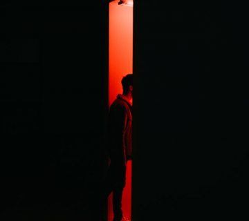 Person standing on opened doorway 2276051 360x320