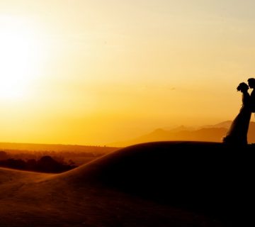 Silhouette of man and woman standing on rock formation 3998368 360x320