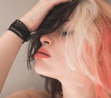 Woman touching her hair 3979460 360x320