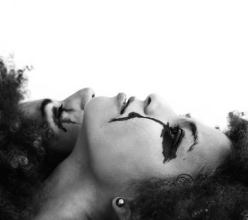 Grayscale photo of two women lying on white surface 2092872 360x320