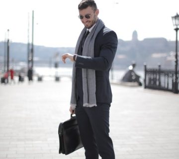 Man in black suit holding leather briefcase 3778212 360x320