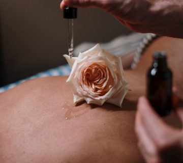 Orange petaled flower on a person s back 3997984 360x320