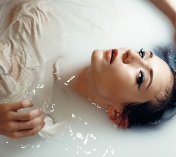 Woman in white shirt taking bath on white water 3230267 360x320